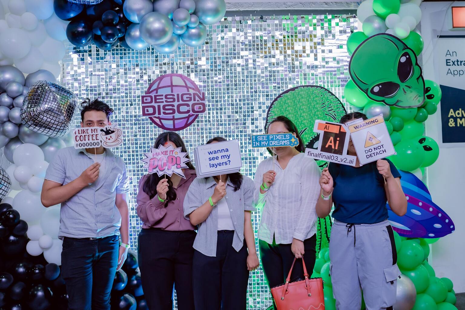 Happy participants posing for for a disco themed photo-op.
